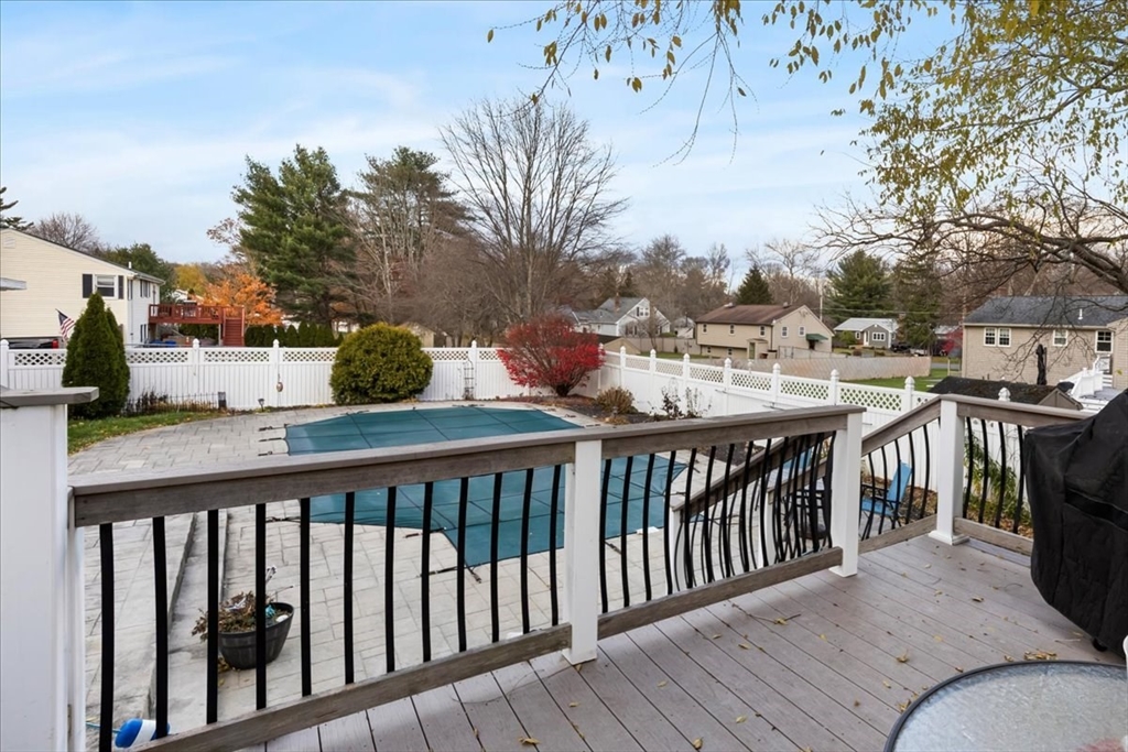 107 Ann Street Raynham, MA 02767 - Photo 3 of 34 a view of a balcony with wooden floor and fence