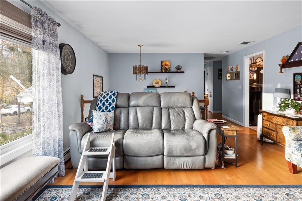 107 Ann Street Raynham, MA 02767 - Photo 8 of 34 a living room with furniture and a flat screen tv