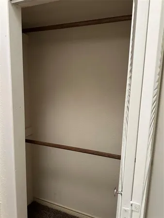 a bathroom with a granite countertop shower and a sink