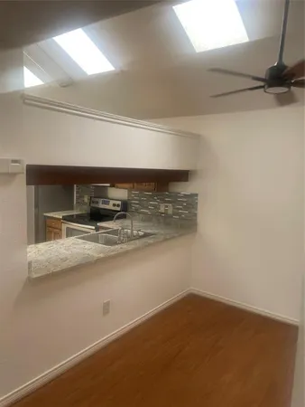 a kitchen with a sink cabinets and appliances