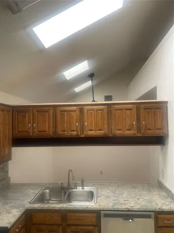 a kitchen with a sink and cabinets