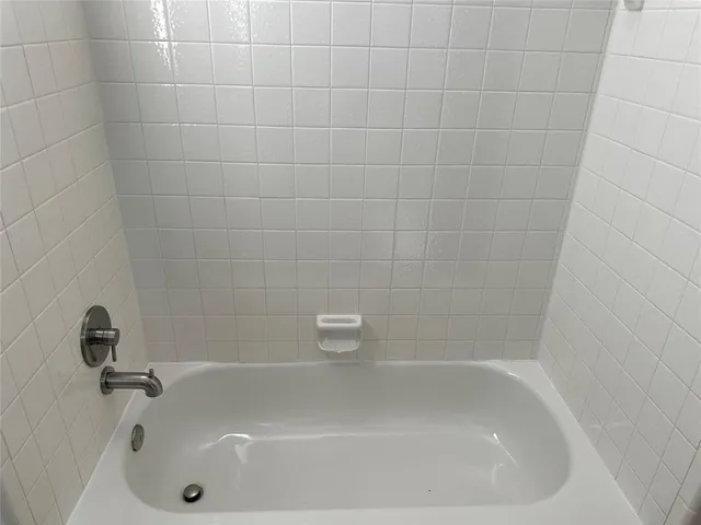 a close up of a bathtub in a bathroom