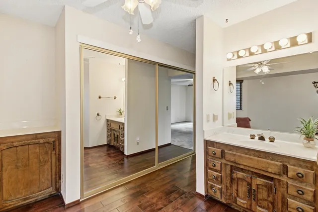 a bathroom with a double vanity sink and mirror