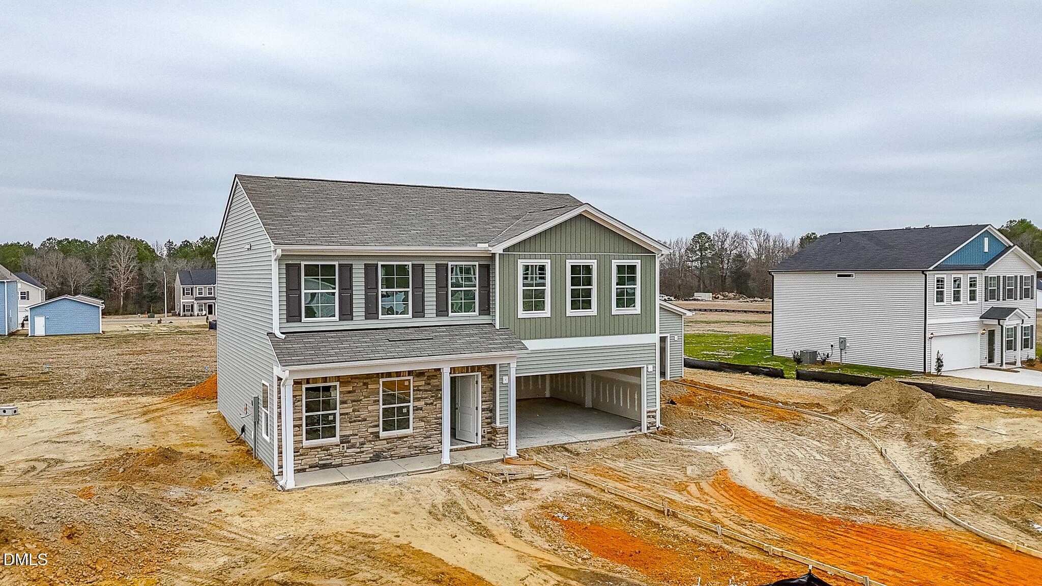 57 Osgood Street Angier, NC 27501 - Photo 2 of 4 a front view of a house with a yard