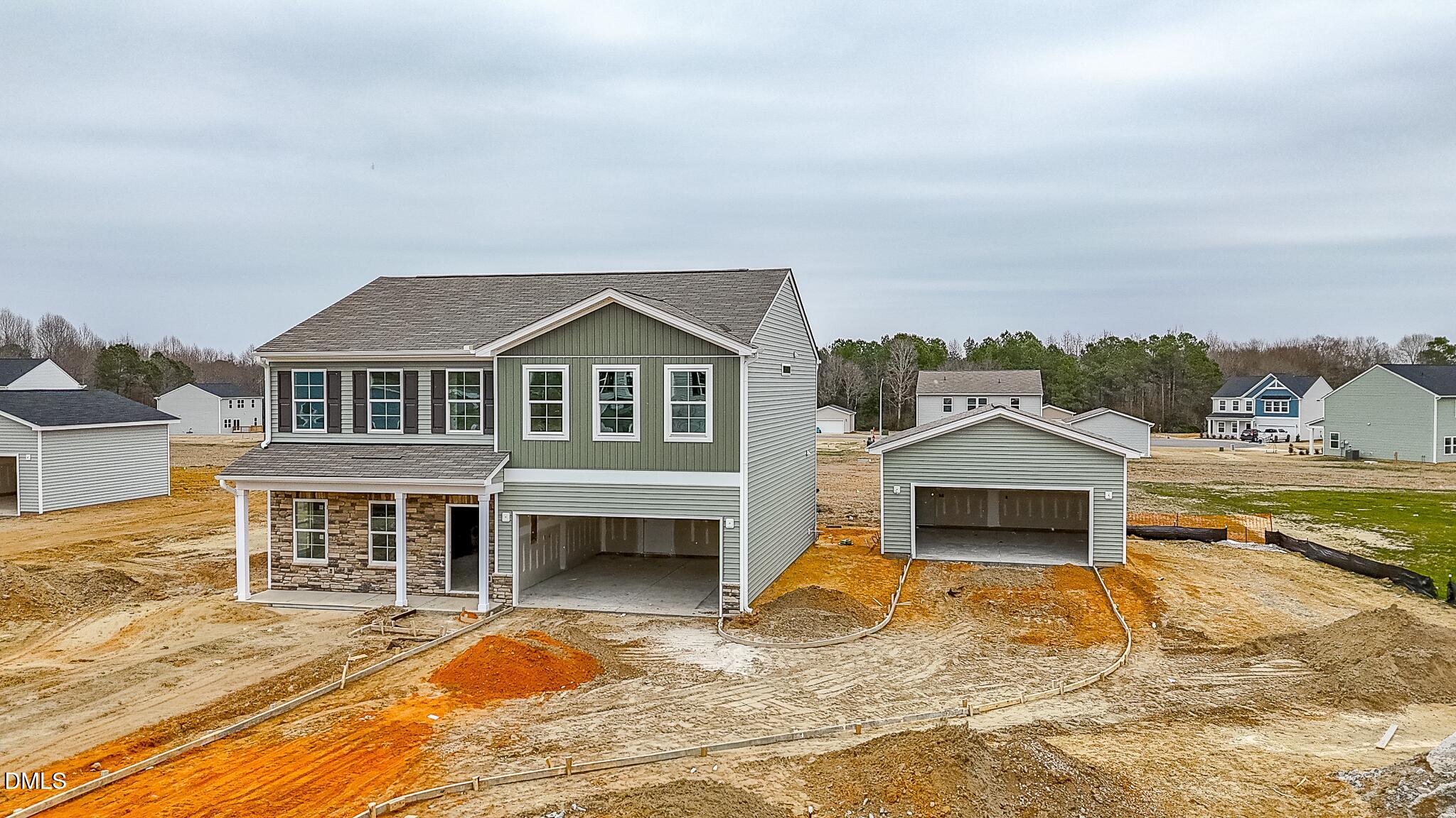57 Osgood Street Angier, NC 27501 - Photo 3 of 4 a front view of a house with a yard