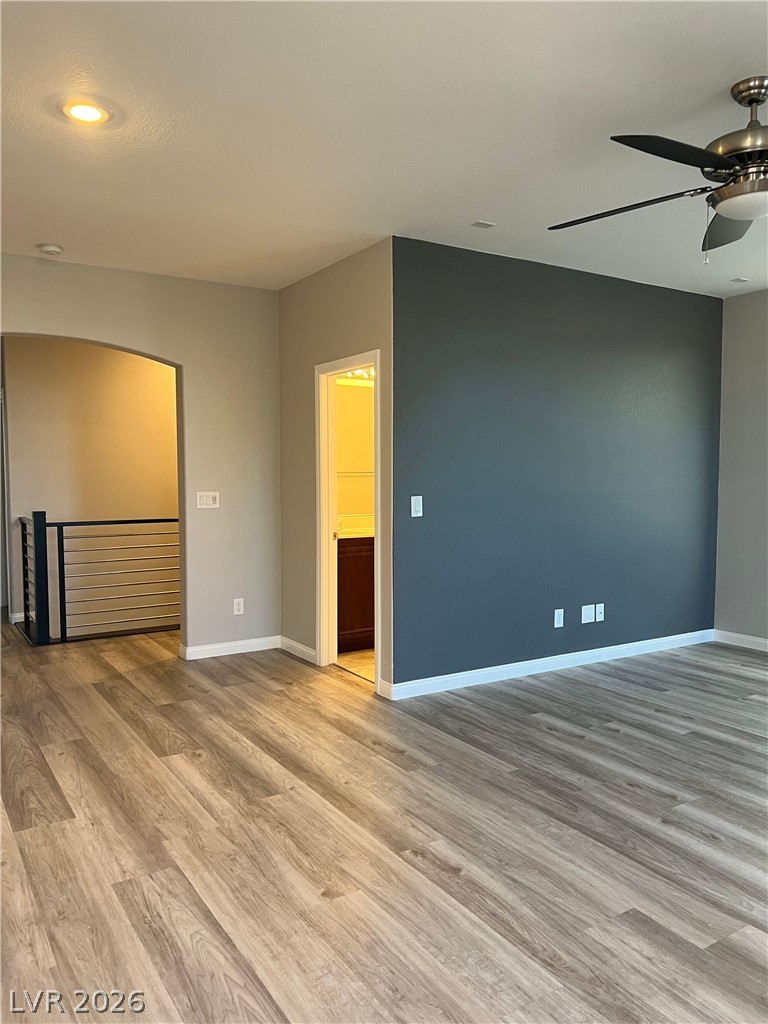 5981 Honeysuckle Ridge Street Las Vegas, NV 89148 - Photo 17 of 29 The seamless flow of hardwood flooring extends through this inviting living area and beyond.