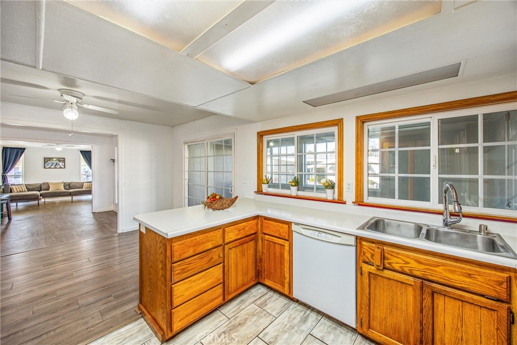 626 North Dearborn Street, Unit 56 Redlands, CA 92374 - Photo 13 of 30 a kitchen with a sink stove and cabinets