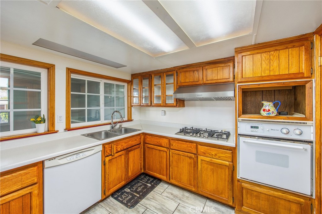626 North Dearborn Street, Unit 56 Redlands, CA 92374 - Photo 14 of 30 a kitchen with stainless steel appliances granite countertop a sink and cabinets