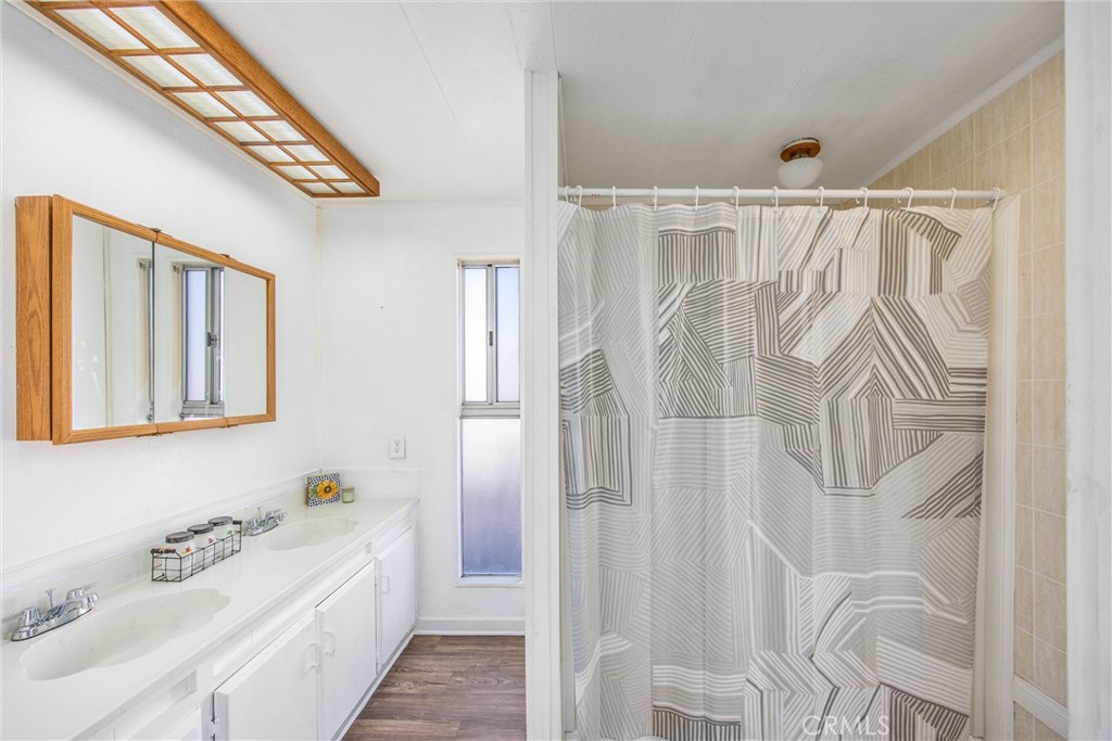 626 North Dearborn Street, Unit 56 Redlands, CA 92374 - Photo 17 of 30 a bathroom with a bathtub and a shower