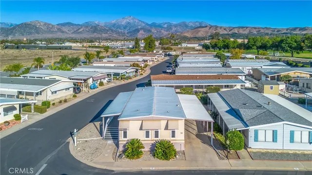 an aerial view of a house with a lake view