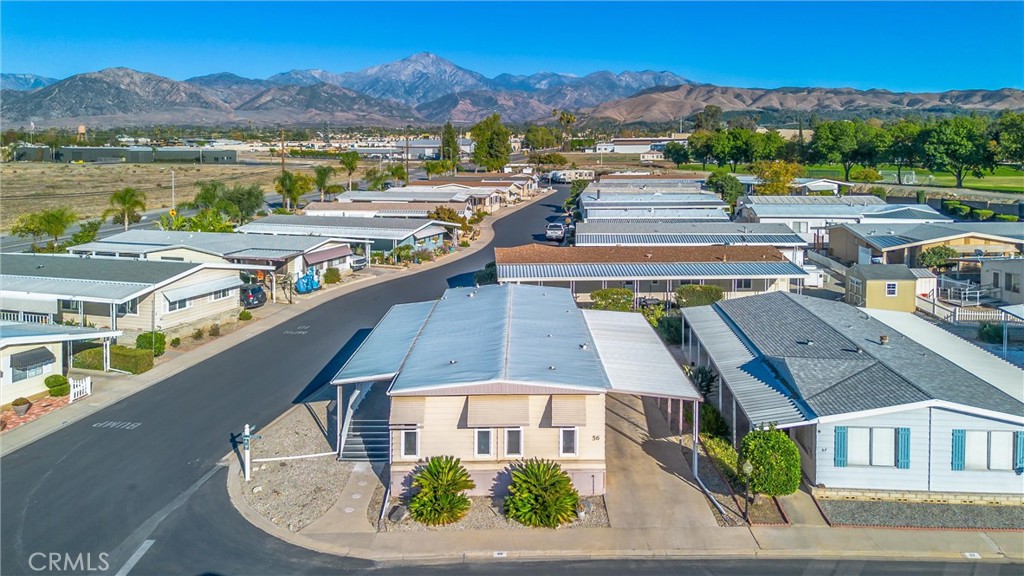626 North Dearborn Street, Unit 56 Redlands, CA 92374 - Photo 2 of 30 an aerial view of a house with a lake view