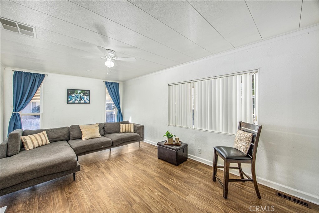 626 North Dearborn Street, Unit 56 Redlands, CA 92374 - Photo 5 of 30 a living room with furniture and a potted plant