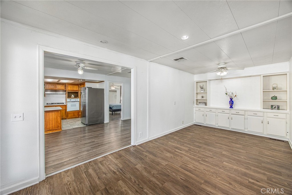 626 North Dearborn Street, Unit 56 Redlands, CA 92374 - Photo 6 of 30 a view of an empty room with wooden floor