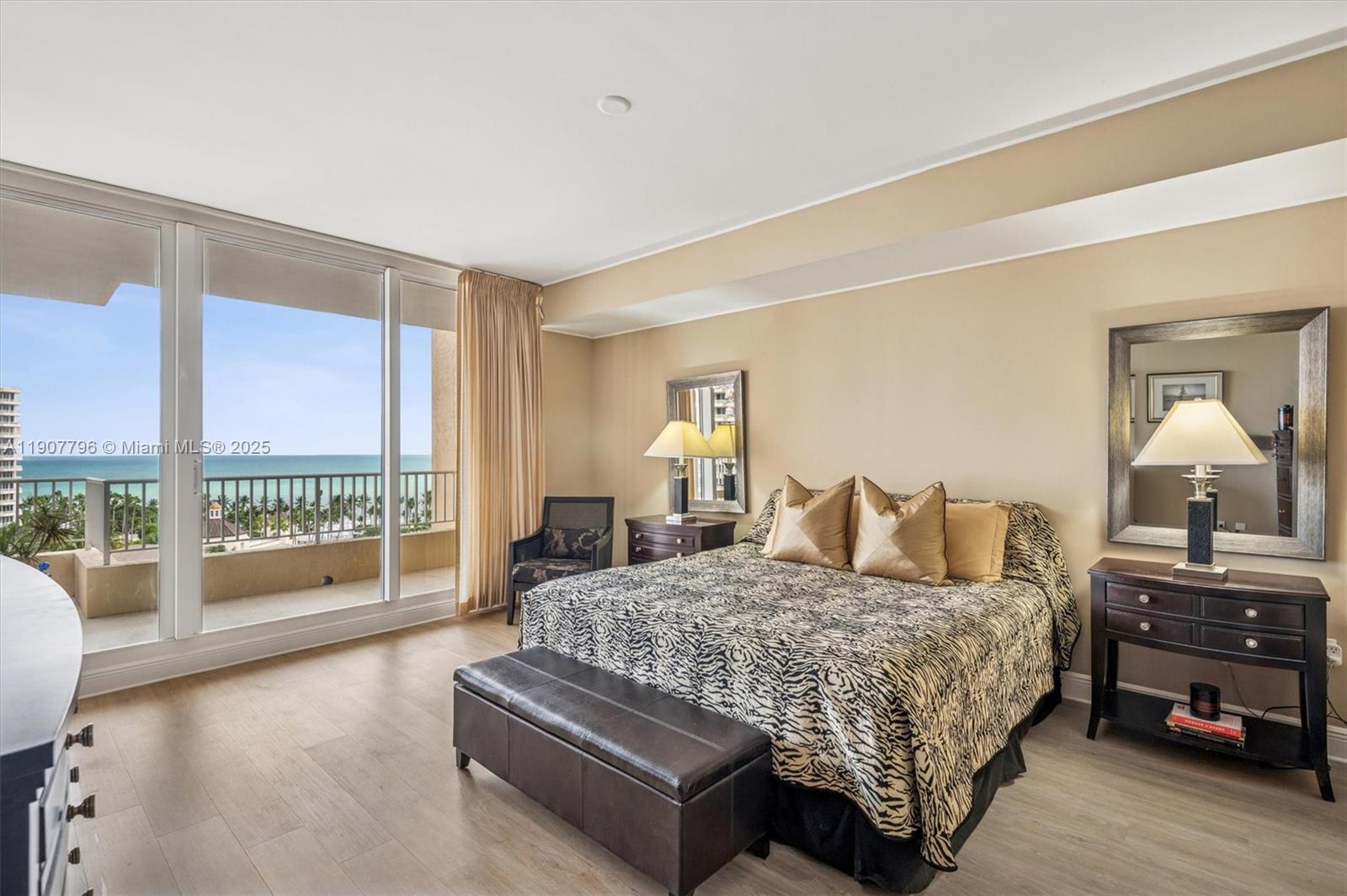 789 Crandon Boulevard, Unit 1005 Key Biscayne, FL 33149 - Photo 15 of 60 a bedroom with a large bed and a large window