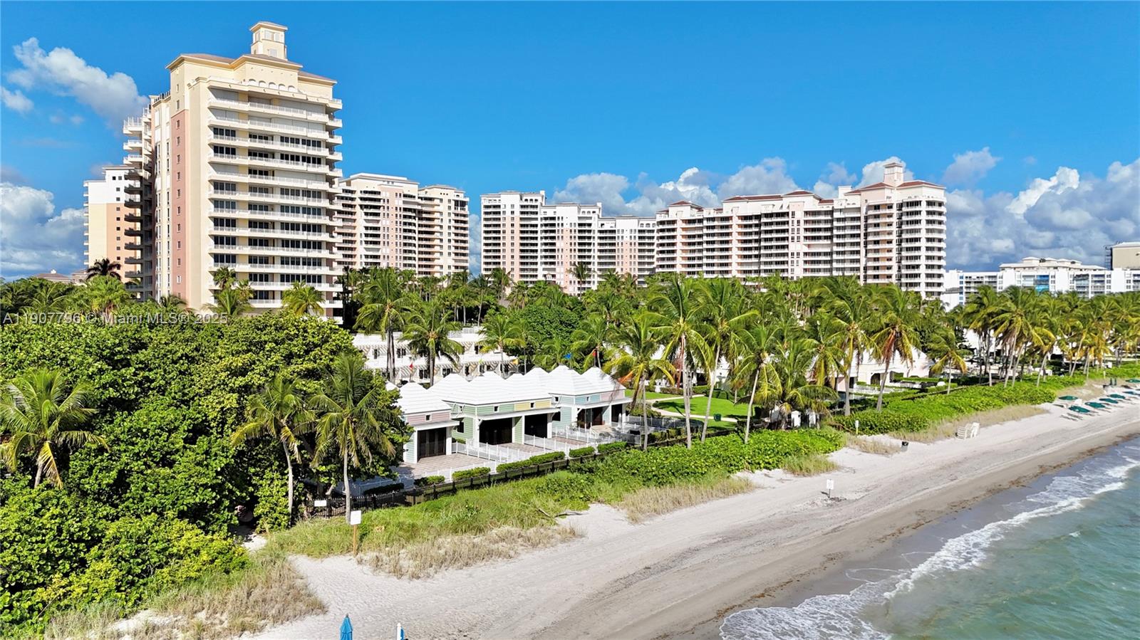 789 Crandon Boulevard, Unit 1005 Key Biscayne, FL 33149 - Photo 22 of 60 a front view of a building with a garden and plants