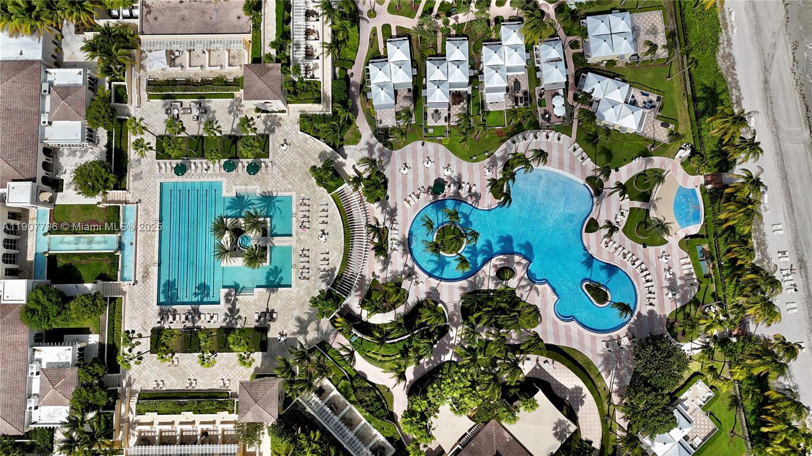 789 Crandon Boulevard, Unit 1005 Key Biscayne, FL 33149 - Photo 26 of 60 an aerial view of multi story residential apartment building with yard