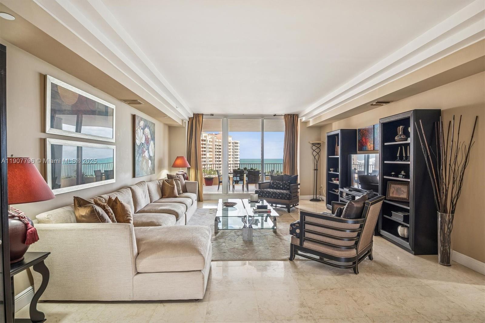 789 Crandon Boulevard, Unit 1005 Key Biscayne, FL 33149 - Photo 4 of 60 a living room with furniture and a large window