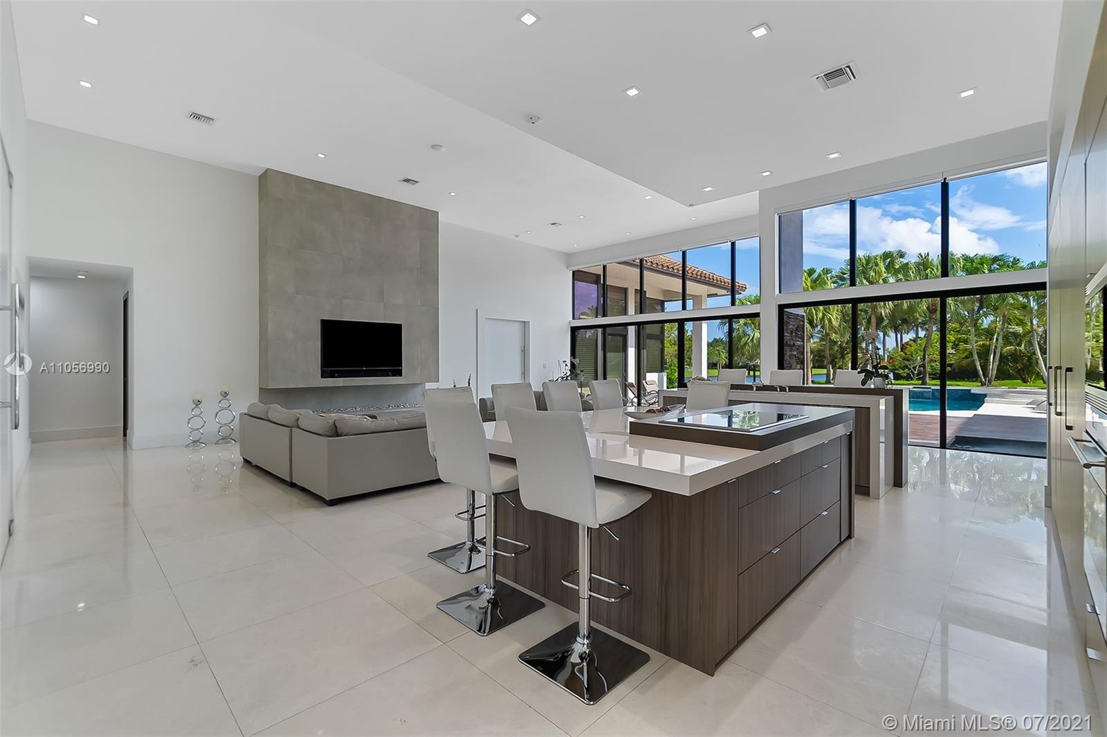 2850 Windmill Ranch Road Weston, FL 33331 - Photo 11 of 50 a living room with furniture and a flat screen tv