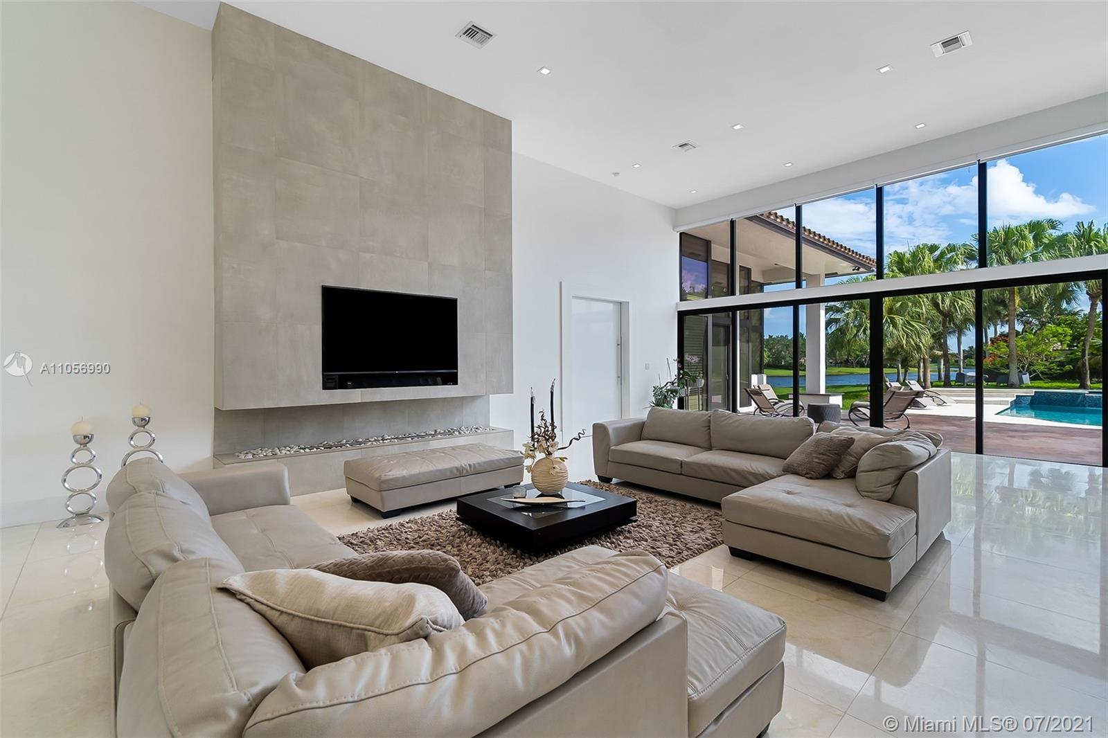 2850 Windmill Ranch Road Weston, FL 33331 - Photo 16 of 50 a living room with furniture and a flat screen tv