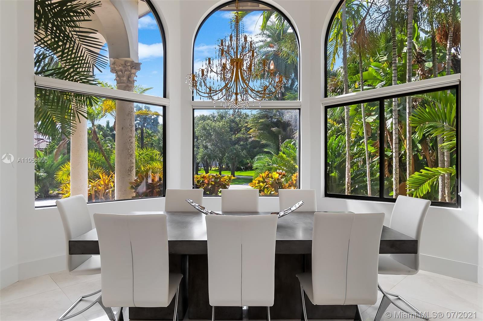 2850 Windmill Ranch Road Weston, FL 33331 - Photo 19 of 50 a dining room with furniture a chandelier and wooden floor
