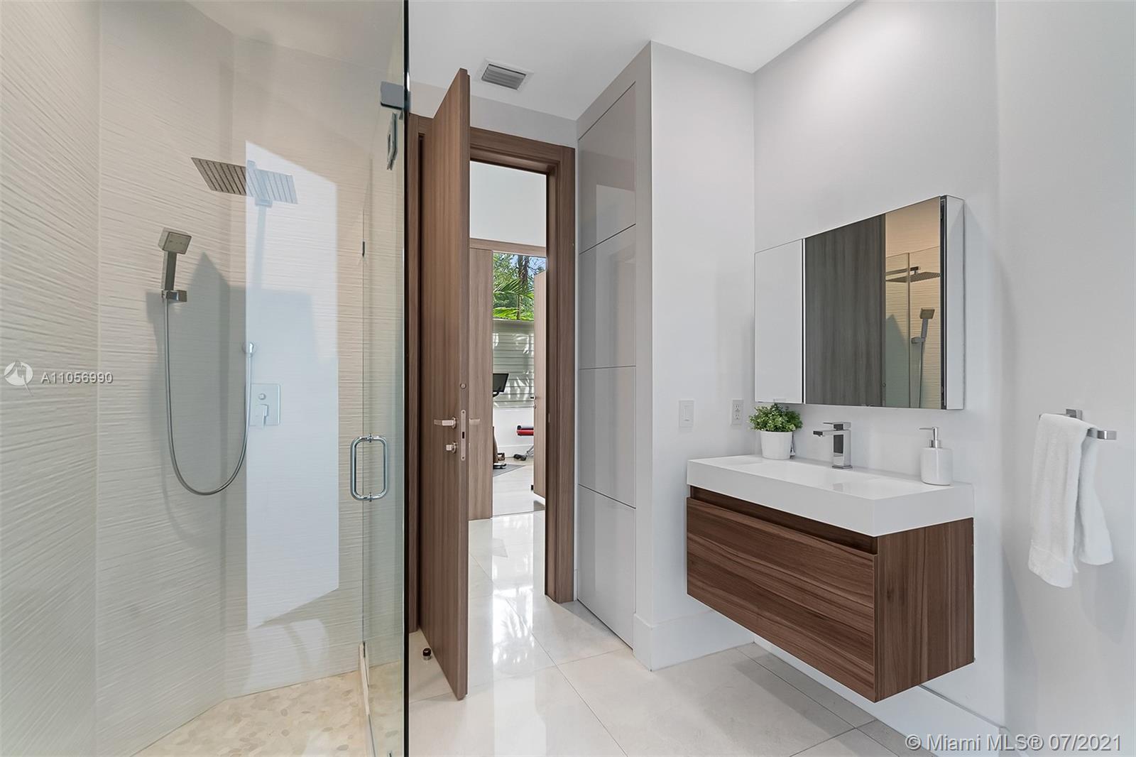 2850 Windmill Ranch Road Weston, FL 33331 - Photo 28 of 50 a bathroom with a double vanity sink mirror and shower