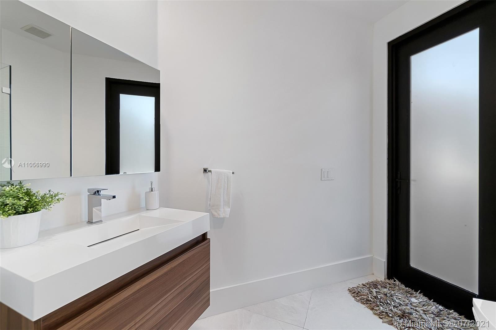 2850 Windmill Ranch Road Weston, FL 33331 - Photo 34 of 50 a bathroom with a sink and a mirror