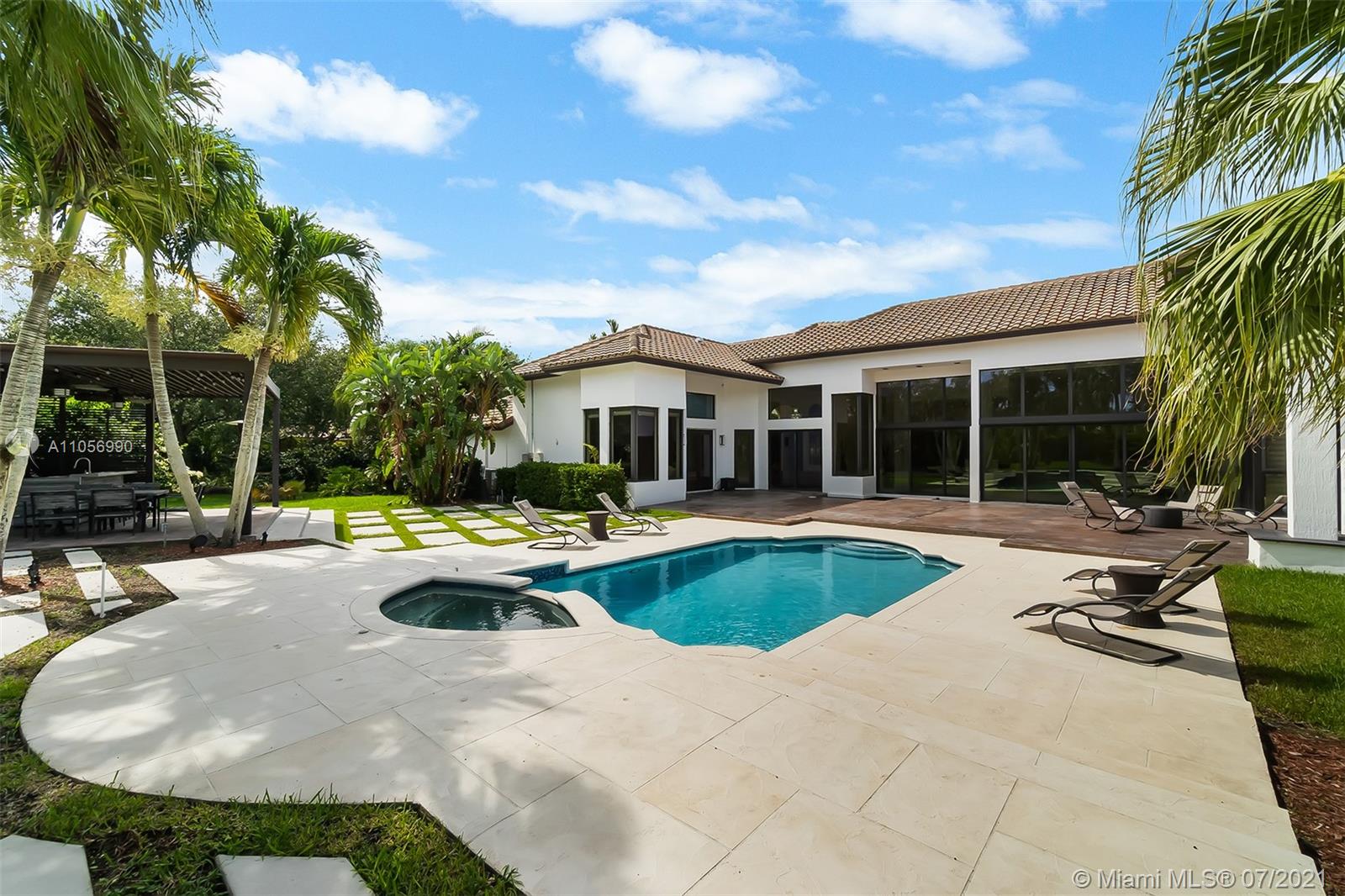 2850 Windmill Ranch Road Weston, FL 33331 - Photo 36 of 50 a view of swimming pool with outdoor seating and house in the background