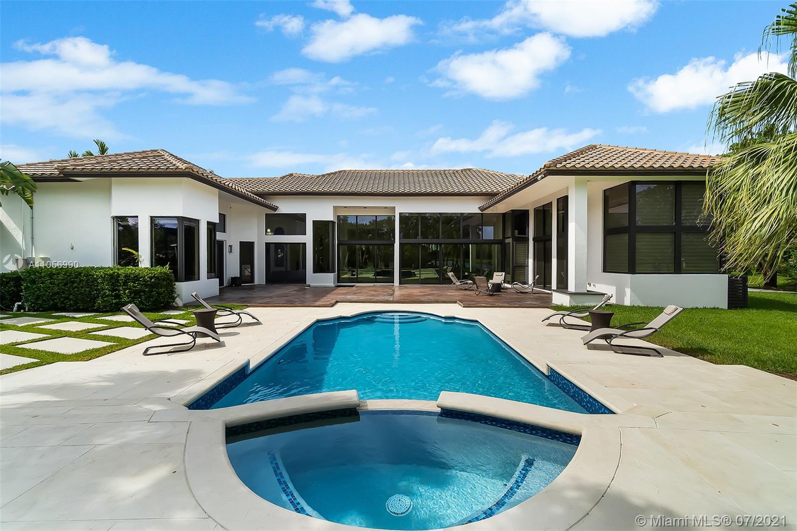 2850 Windmill Ranch Road Weston, FL 33331 - Photo 37 of 50 a view of a house with swimming pool and sitting area