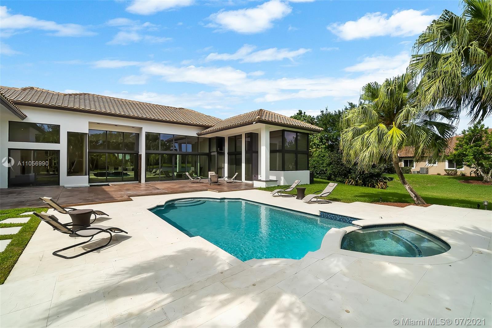2850 Windmill Ranch Road Weston, FL 33331 - Photo 38 of 50 a view of a house with swimming pool and sitting area