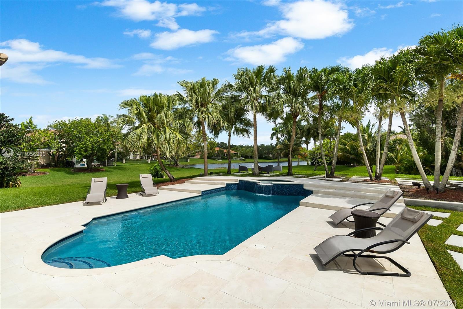 2850 Windmill Ranch Road Weston, FL 33331 - Photo 40 of 50 a view of a swimming pool with a patio