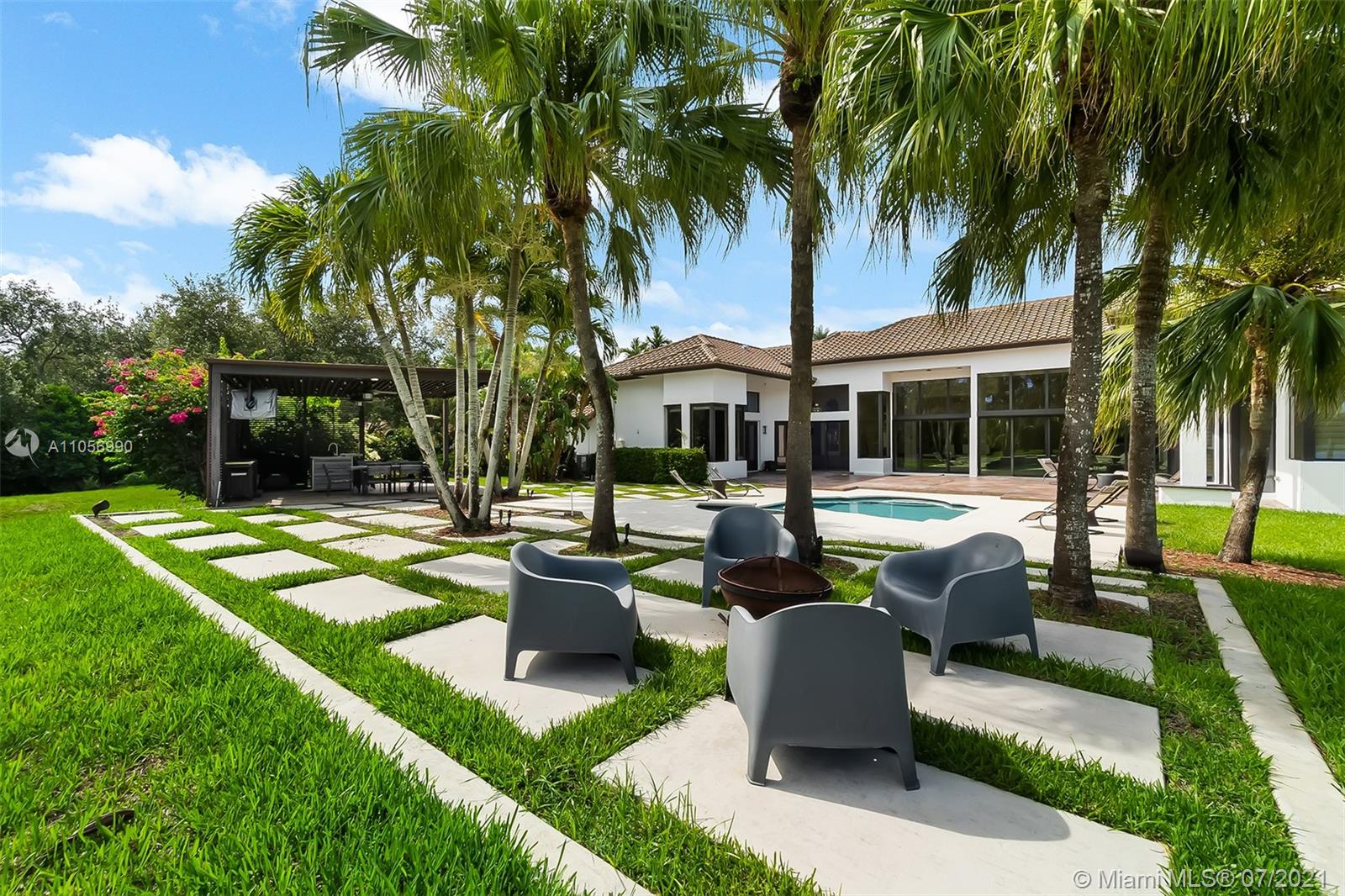 2850 Windmill Ranch Road Weston, FL 33331 - Photo 41 of 50 a view of a house with backyard swimming pool and sitting area