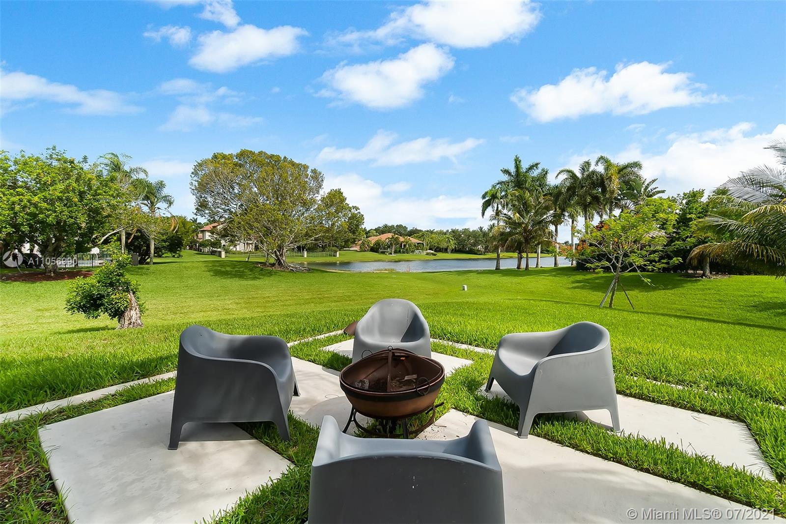 2850 Windmill Ranch Road Weston, FL 33331 - Photo 42 of 50 a view of a garden from a patio