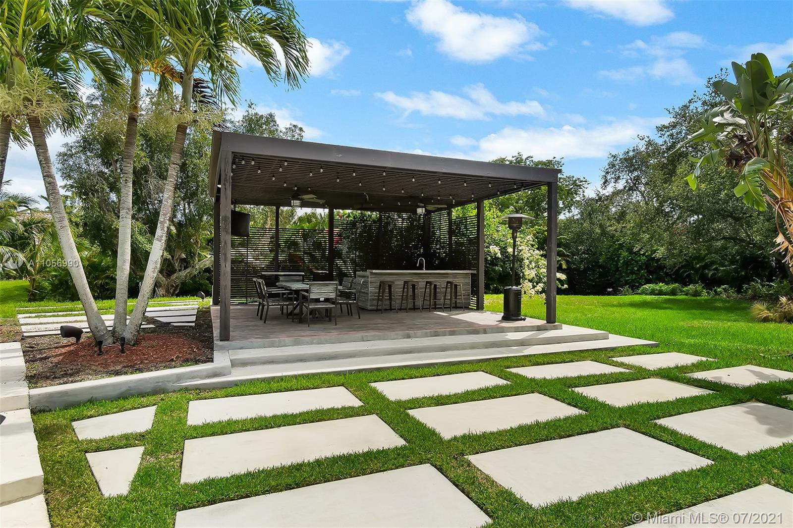 2850 Windmill Ranch Road Weston, FL 33331 - Photo 43 of 50 a view of a swimming pool with an outdoor seating