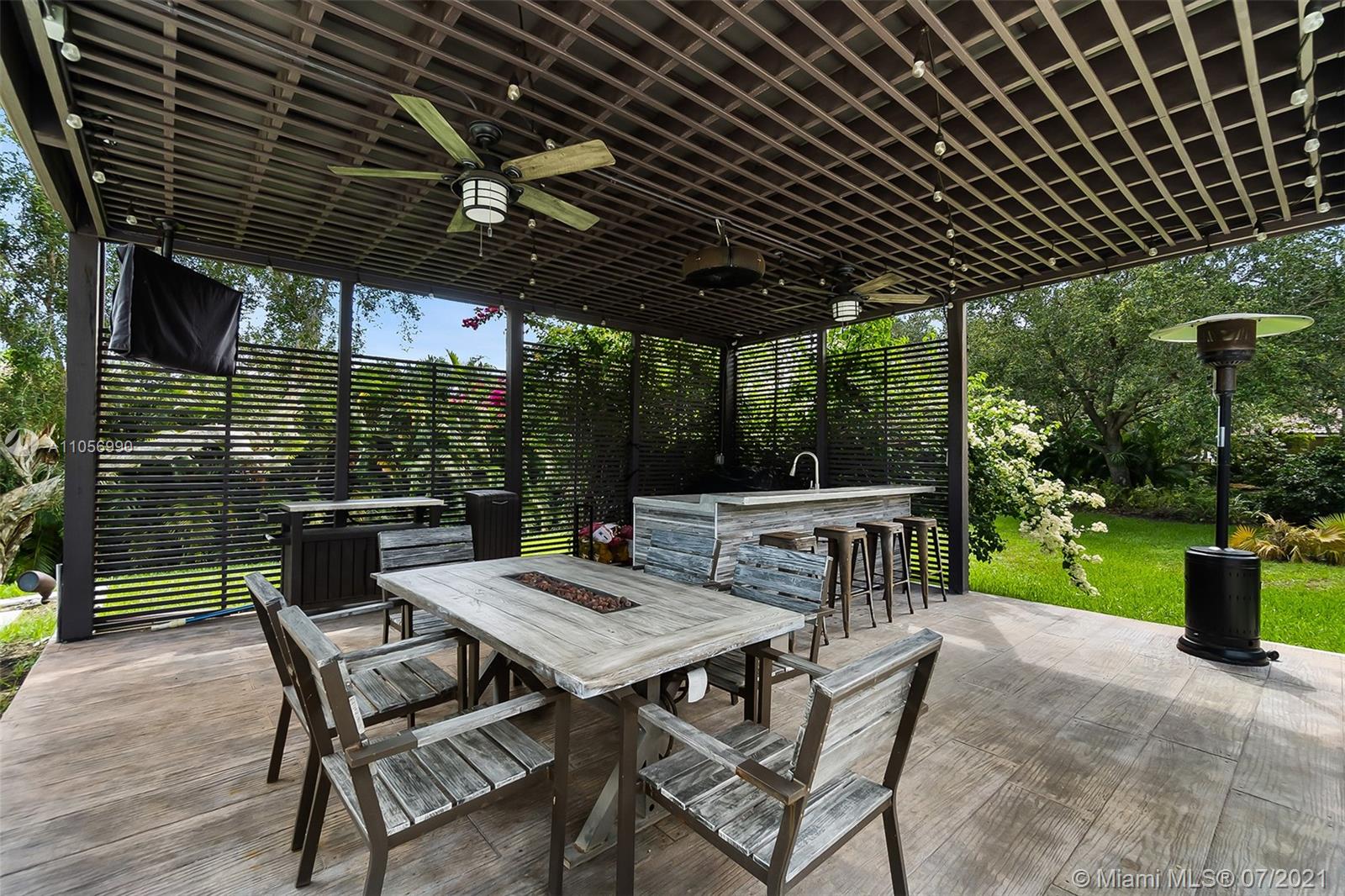 2850 Windmill Ranch Road Weston, FL 33331 - Photo 44 of 50 a view of a chairs and table in patio