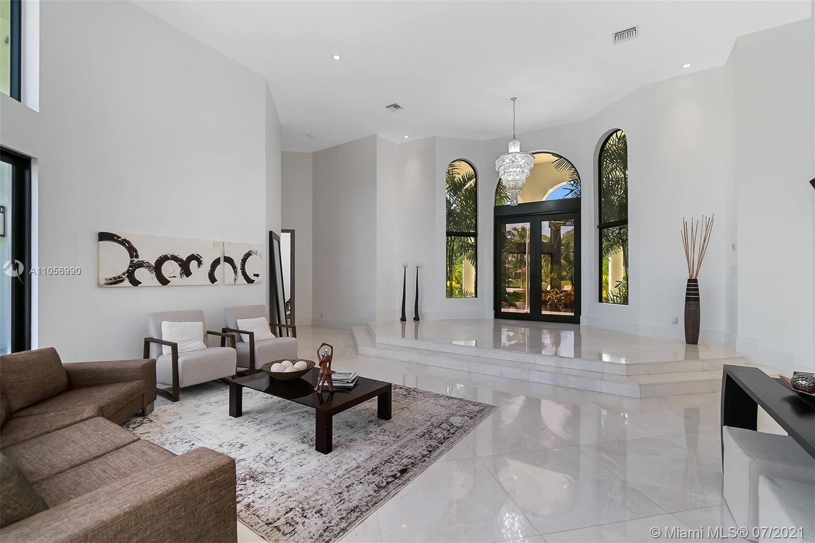 2850 Windmill Ranch Road Weston, FL 33331 - Photo 7 of 50 a living room with furniture and a chandelier