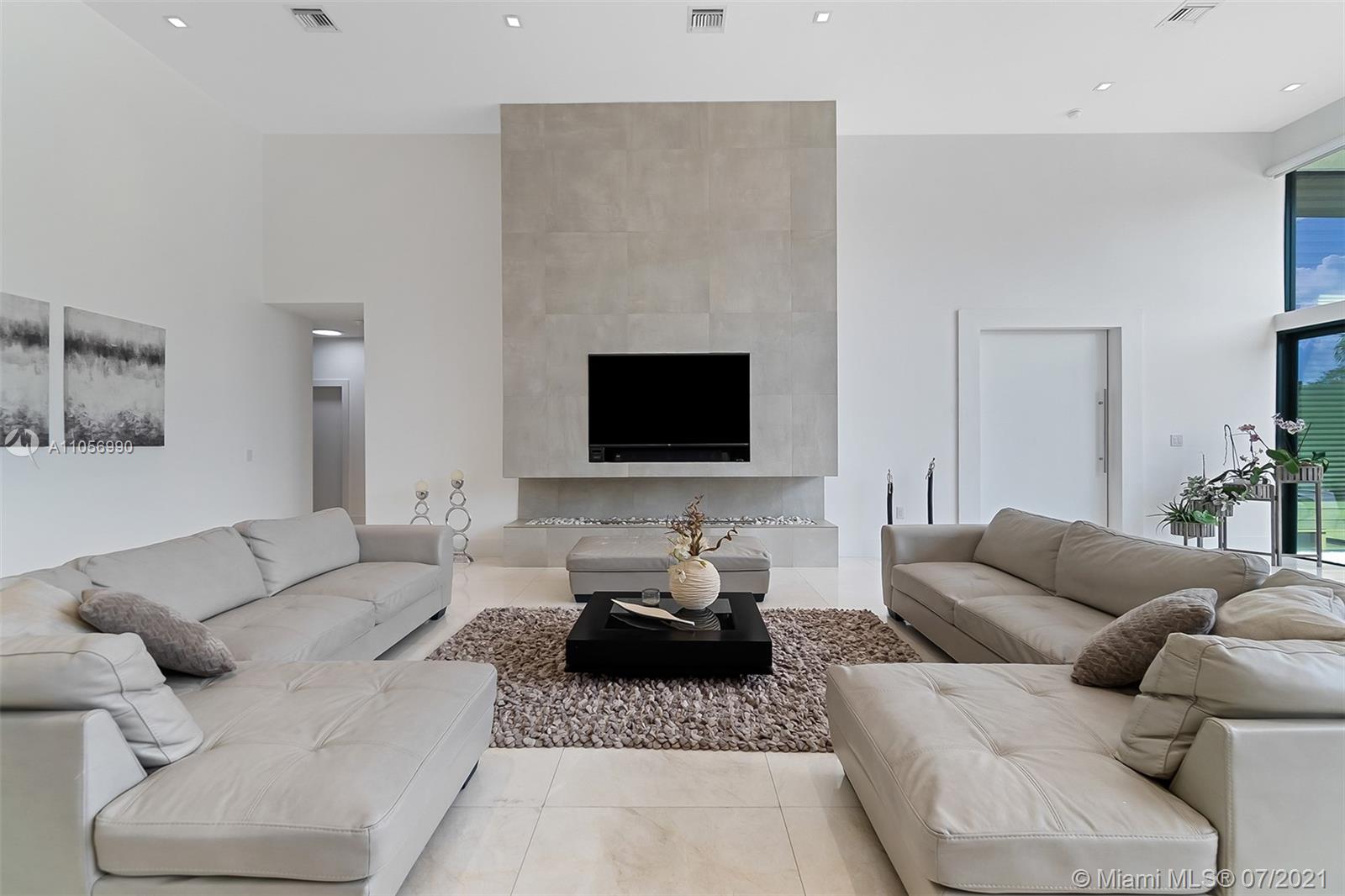 2850 Windmill Ranch Road Weston, FL 33331 - Photo 9 of 50 a living room with furniture and a flat screen tv
