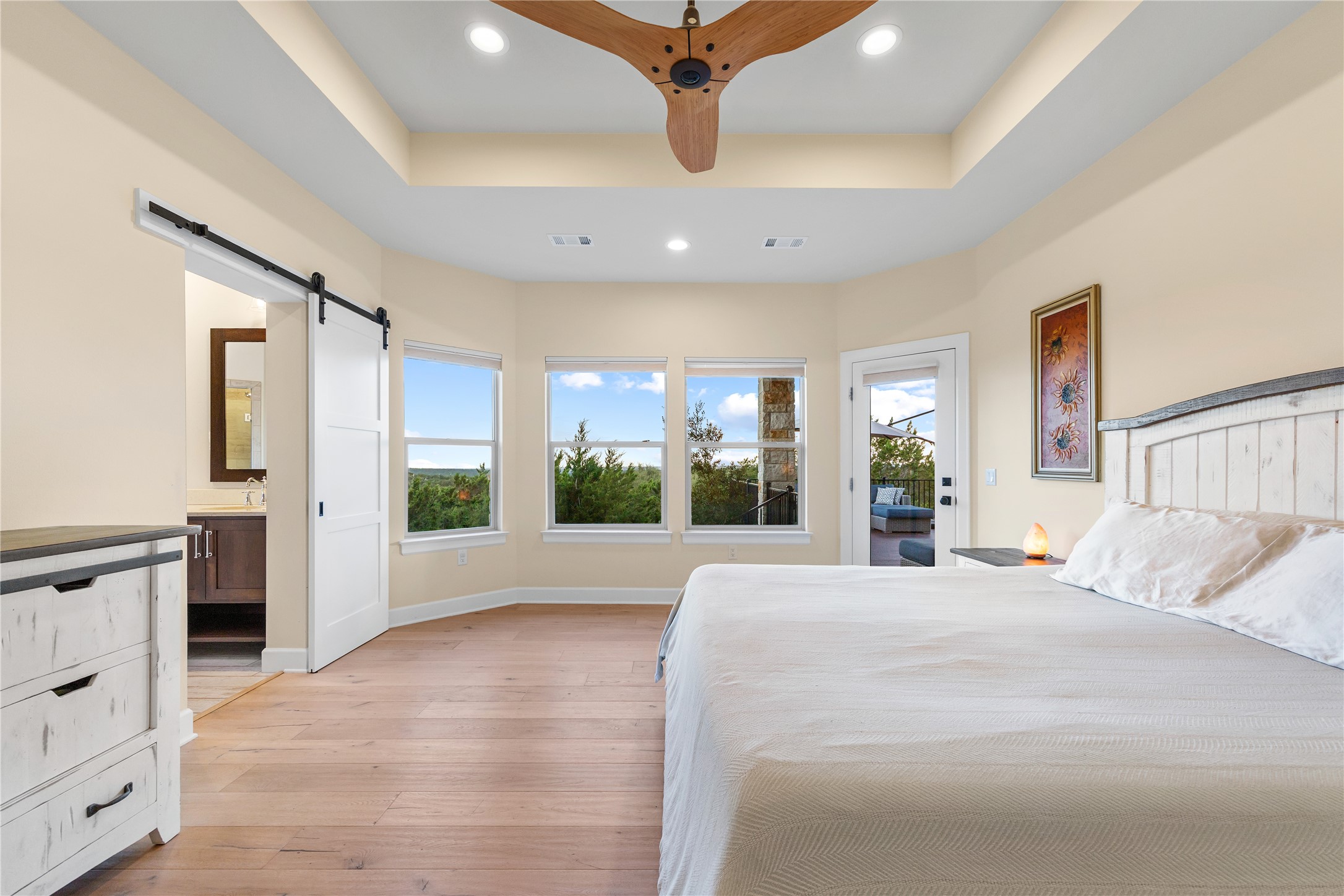 1017 Westland Ridge Road Dripping Springs, TX 78620 - Photo 11 of 40 A tray ceiling and warm wood flooring define this serene main-level retreat.