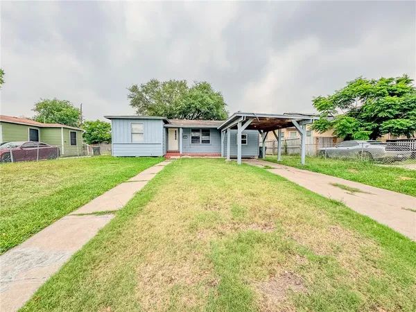 a front view of a house with yard