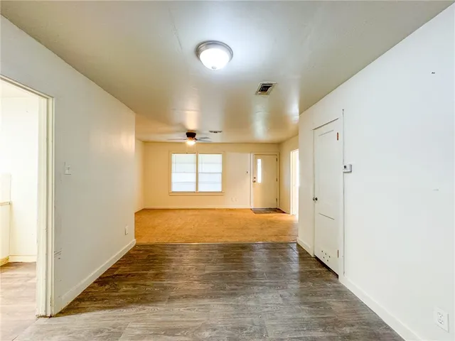 a view of a kitchen with wooden floor