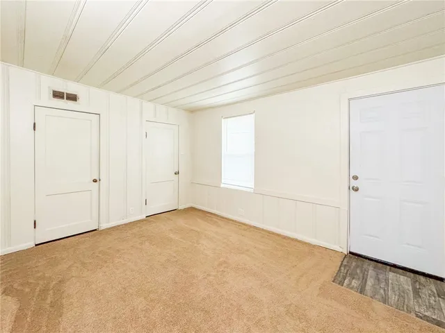 an empty room with a empty space and window