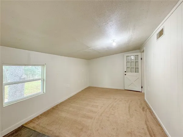 a view of an empty room and window