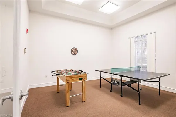 a view of a dining room with furniture and front door
