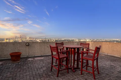 a view of a terrace with furniture and stove