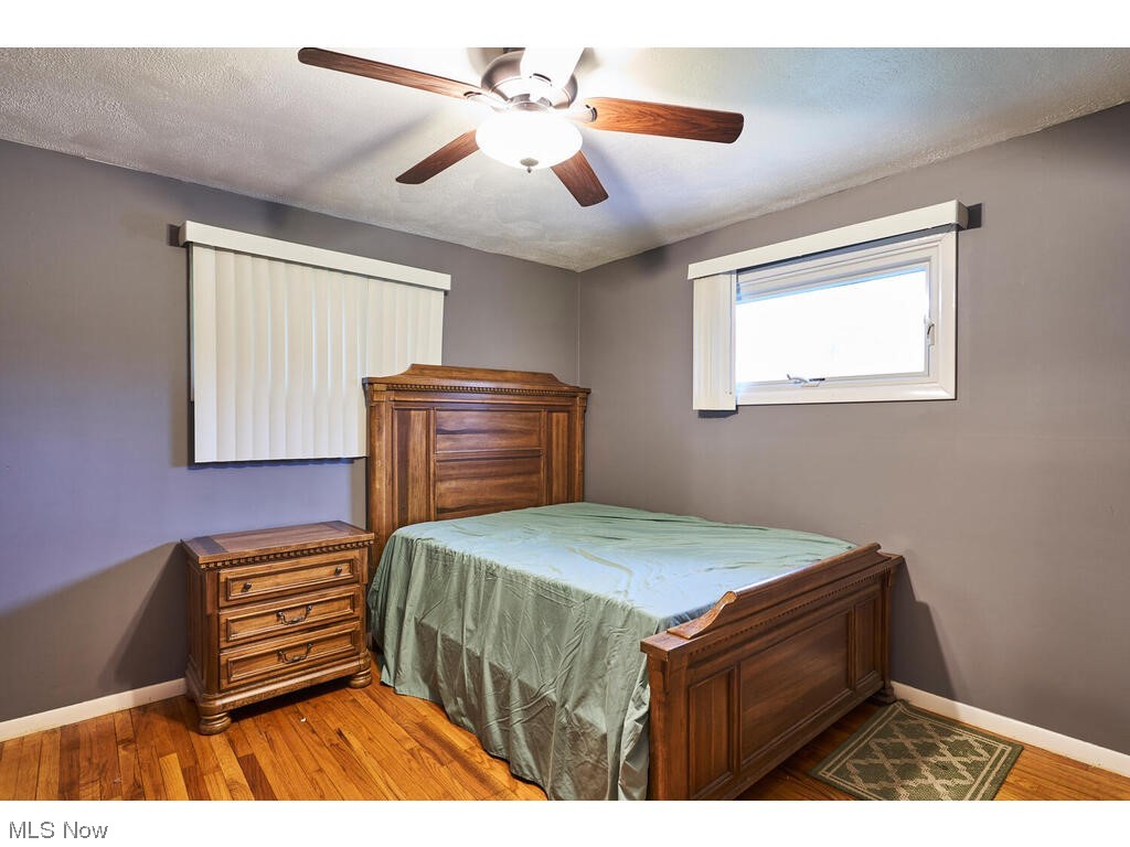 11530 Girdled Road Painesville, OH 44077 - Photo 28 of 32 Bedroom featuring hardwood / wood-style floors and ceiling fan