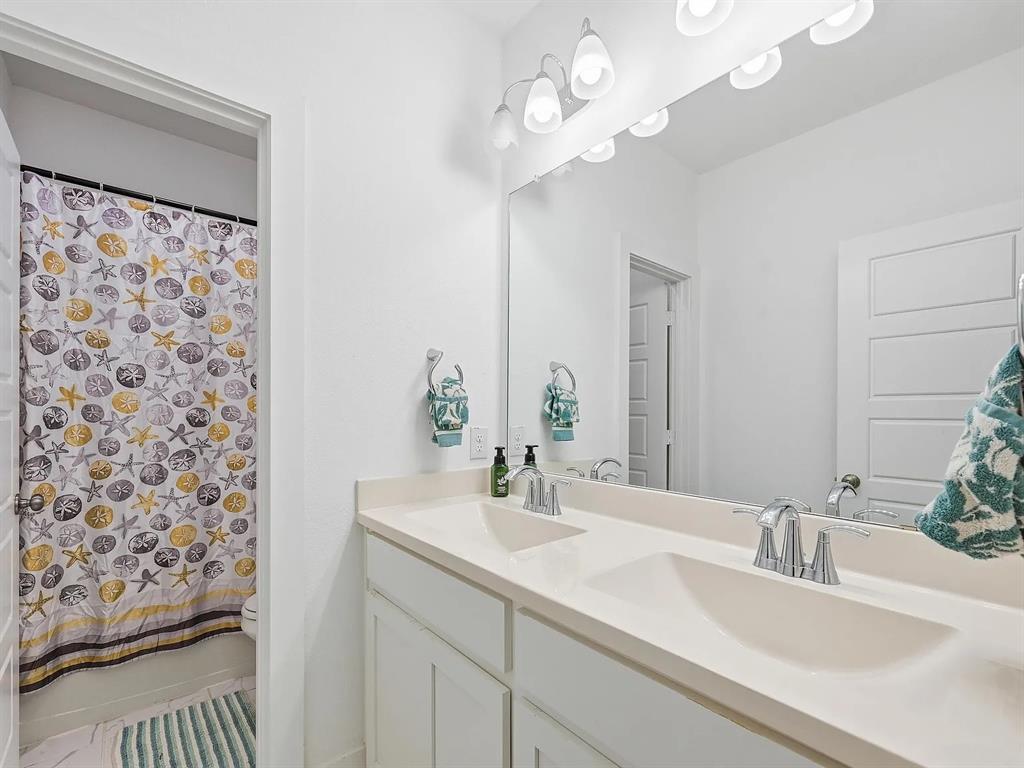 6844 Verandah Way Irving, TX 75039 - Photo 19 of 24 a bathroom with a sink double vanity and a mirror
