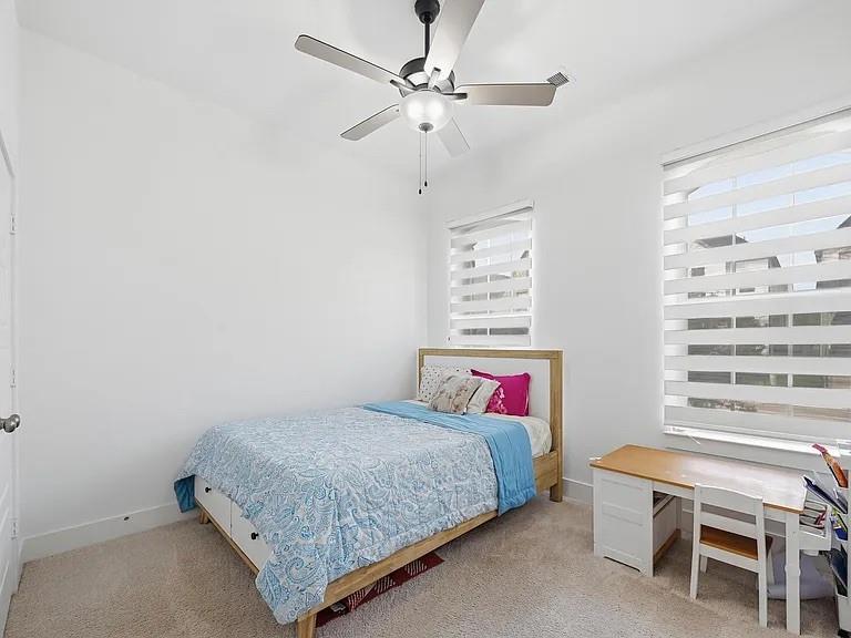 6844 Verandah Way Irving, TX 75039 - Photo 20 of 24 a bedroom with a bed window and a chandelier