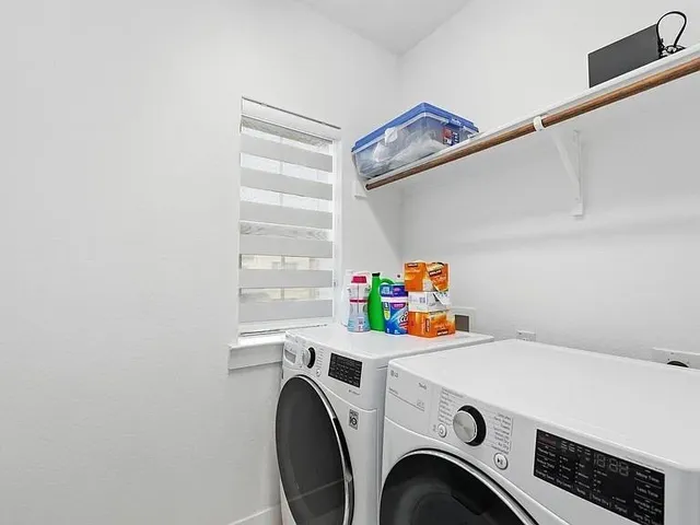 a utility room with dryer and washer