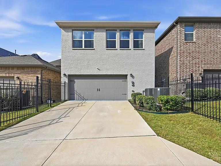 6844 Verandah Way Irving, TX 75039 - Photo 23 of 24 a front view of a house with a yard and garage