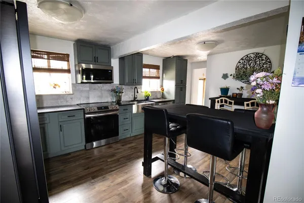 a kitchen with sink and cabinets