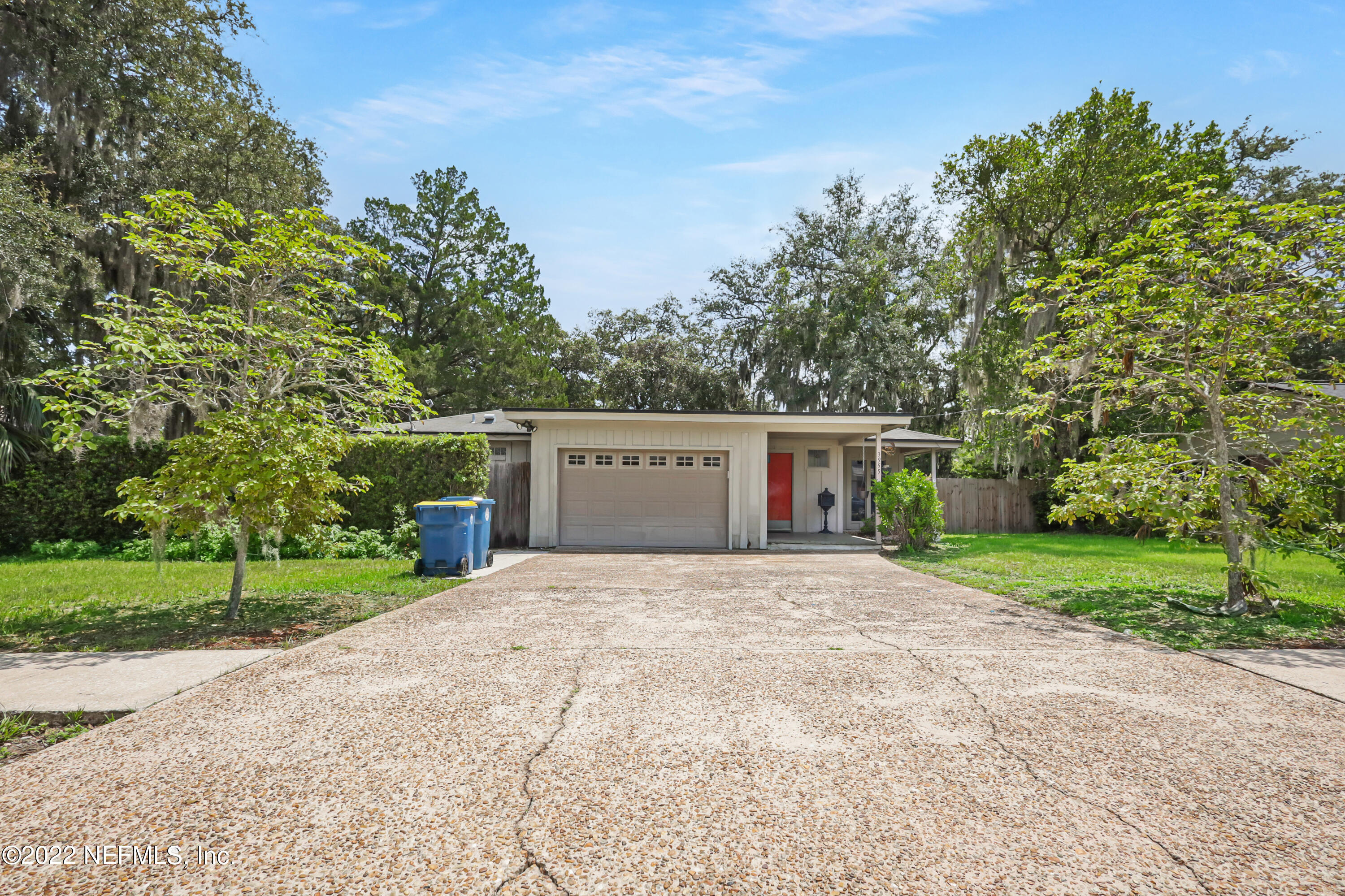 3955 Heidi Road Jacksonville, FL 32277 - Photo 1 of 43 a house with trees in front of it